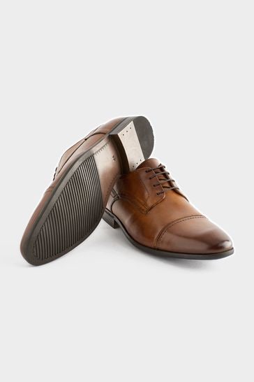 Brown cap toe shoes top