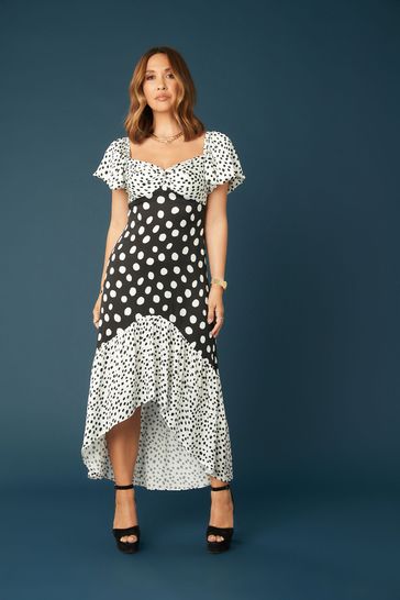 Black spotted asymmetrical dress discount