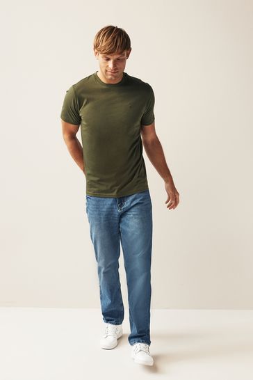 Green t shop shirt and jeans