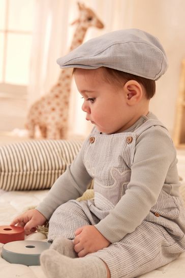 Next baby flat 2025 cap