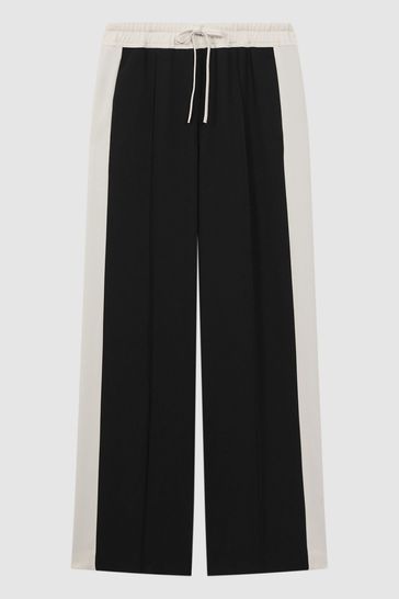 Black trousers shop with white stripe