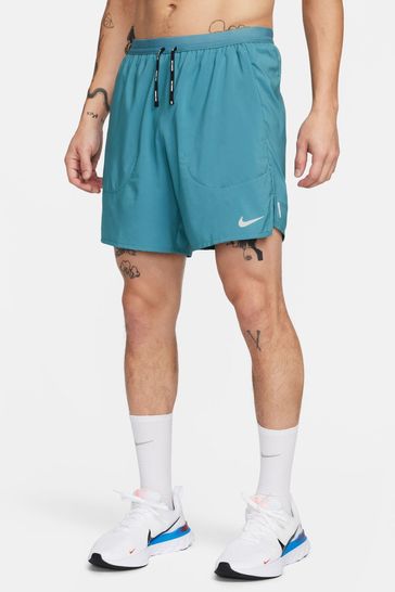 Nike flex stride green hot sale