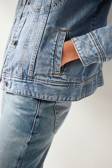 Buy Mid Blue Borg Lined Denim Jacket from Next Bahrain