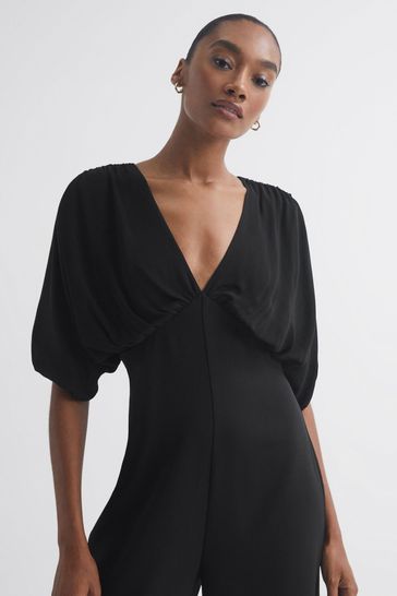 Plunging neckline jumpsuit shop
