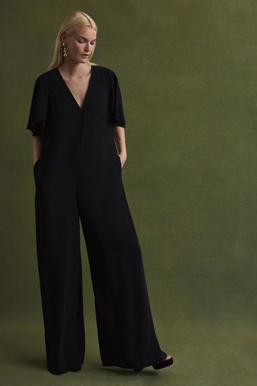 Black jumpsuit shop with cape sleeves