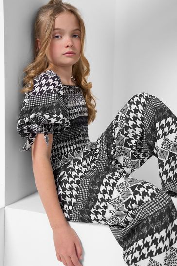 Buy Angel Rocket Gracie Dogtooth Check Black Jumpsuit from Next Germany