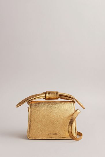 Buy Ted Baker Gold Niasini Bow Detail Metallic Xbody Bag from Next Netherlands