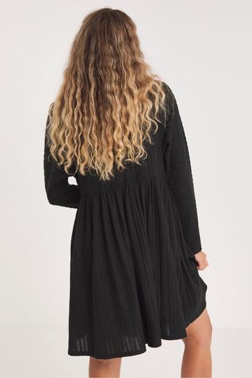 Black smock store dress with sleeves