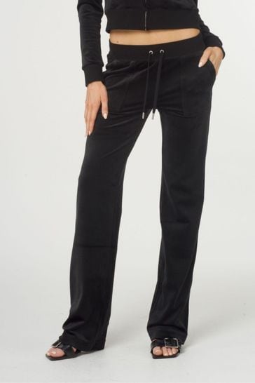 Pantalones de chándal azules de terciopelo clásico en talle medio con bolsillos de Juicy Couture