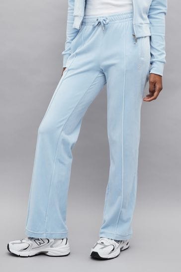 Pantalones deportivos azules de terciopelo suave y pierna recta con pedrería de Juicy Couture