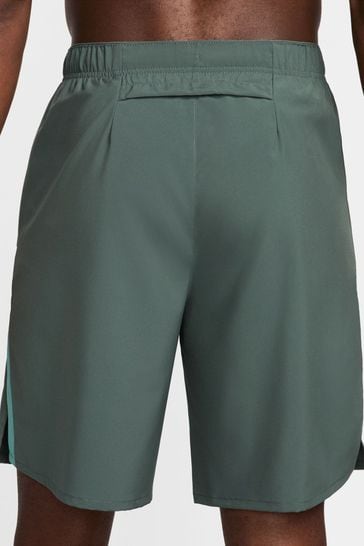 Buy Dark Green 9 Inch Nike Dri FIT Challenger Unlined Running Shorts from Next Ukraine