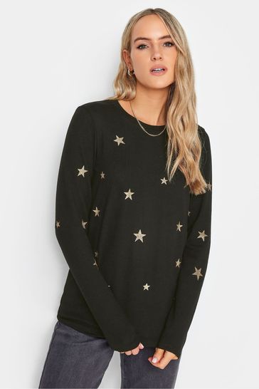 Black sweater store with gold stars