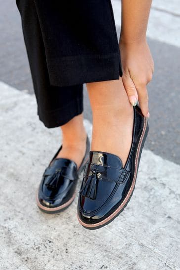 Buy Linzi Black Patent Samson Slip On Loafer With Tassle Trim from