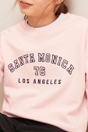 Pink slogan hotsell sweatshirt