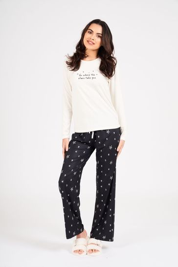 Woman in black and white polka dot long sleeve shirt and red pants standing  on gray photo  Free Engineer Image on Unsplash