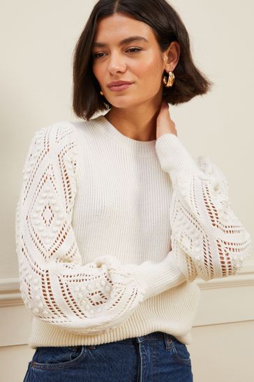 Sweater with pom pom sleeves shop