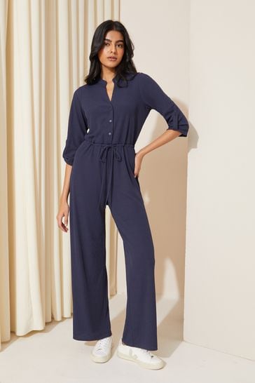 Friends Like These Navy Blue Jersey Long Sleeve Cinched Waist Jumpsuit