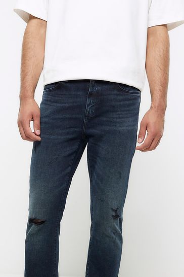 Buy River Island Blue Dark Wash Ripped Skinny Jeans from Next