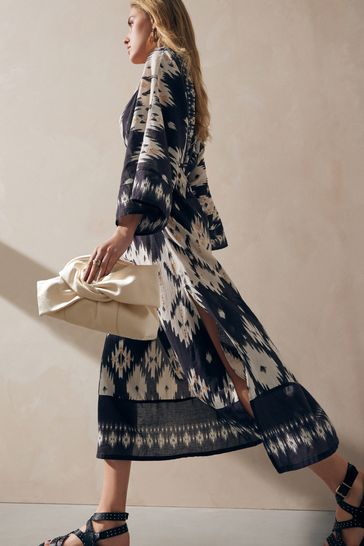 Buy Bone Leather Bow Clutch Bag from Next Netherlands