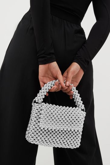 Bolso de mano con bolas plateadas