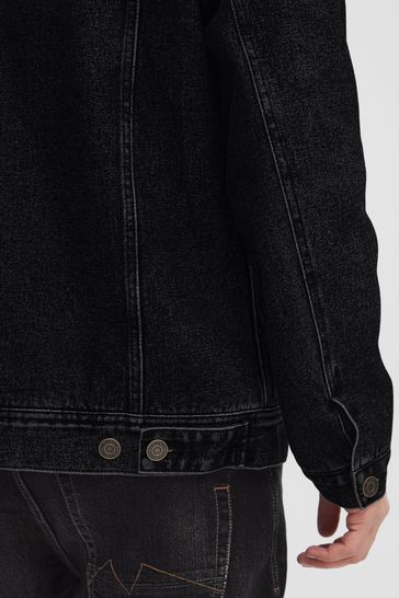 Black denim jacket with design on the sales back