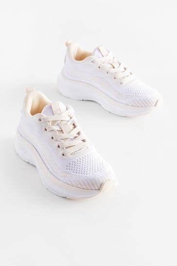 White heeled trainers 2025