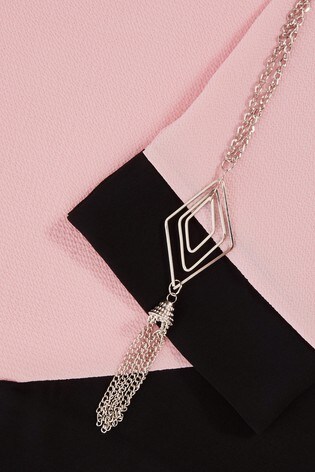 quiz cross hem necklace top