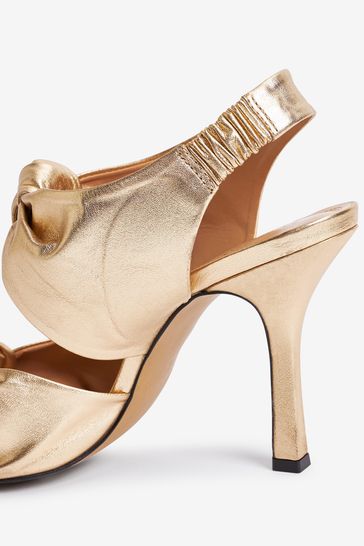 Gold store knot sandals
