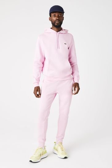 Pink lacoste on sale tracksuit