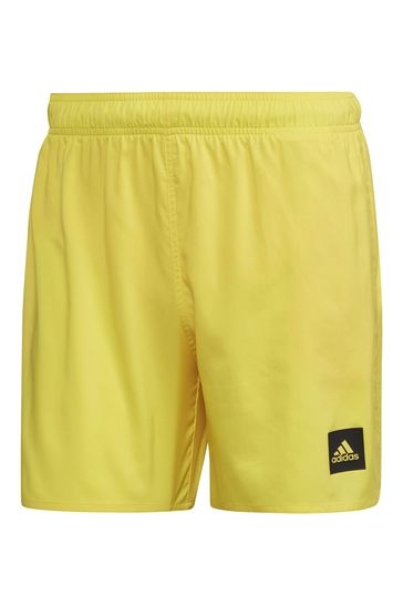 Yellow adidas swim store shorts