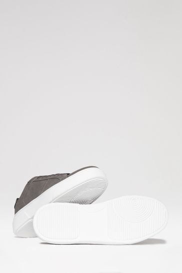 Raised sole trainers store