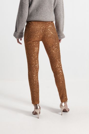 Gold skinny store trousers
