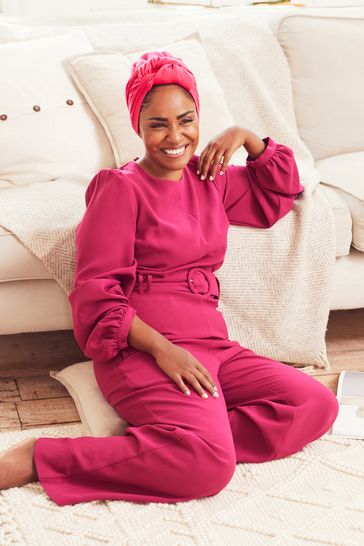 Pink belted jumpsuit on sale
