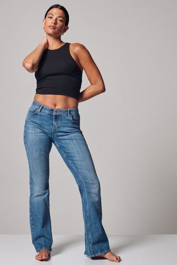 Mid Blue Low Rise Stretch Flare Jeans With Back Split Hem