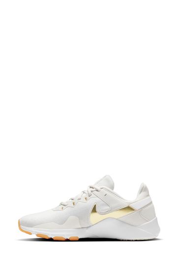 Nike White Gold Legend Essential 2 Trainers