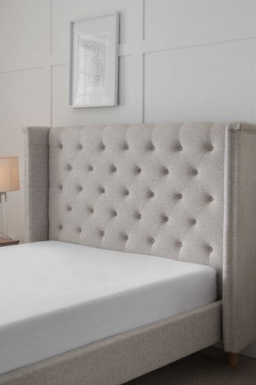 Grid tufted store bed
