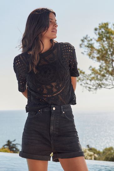 Women's black stretch denim shorts top