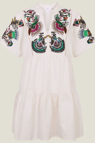 White dress with colorful embroidery best sale