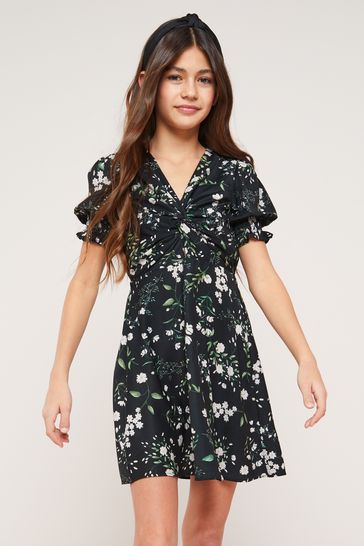 Buy Lipsy Floral Knot Front Mini Dress from the Laura Ashley