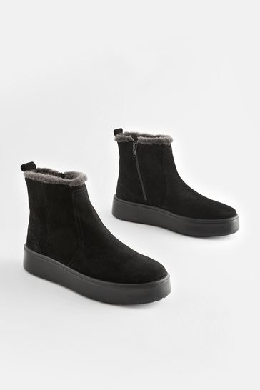 Suede boots best sale with fur trim