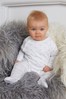 The Little Tailor White Jersey Print Rocking Horse Sleepsuit