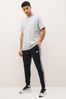 adidas Black Sportswear Essentials Fleece Tapered Cuff 3-Stripes Joggers