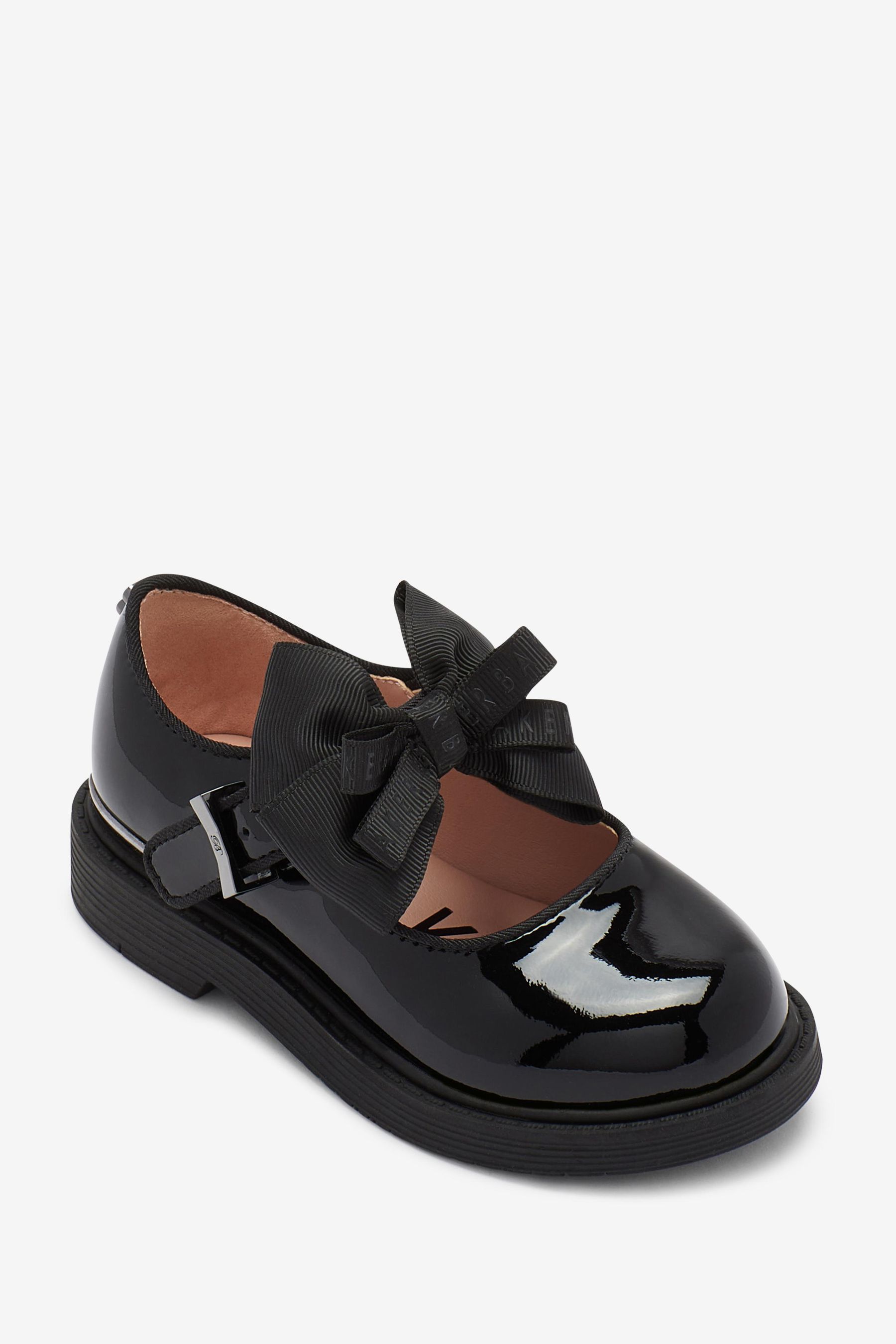 white and black mary jane shoes