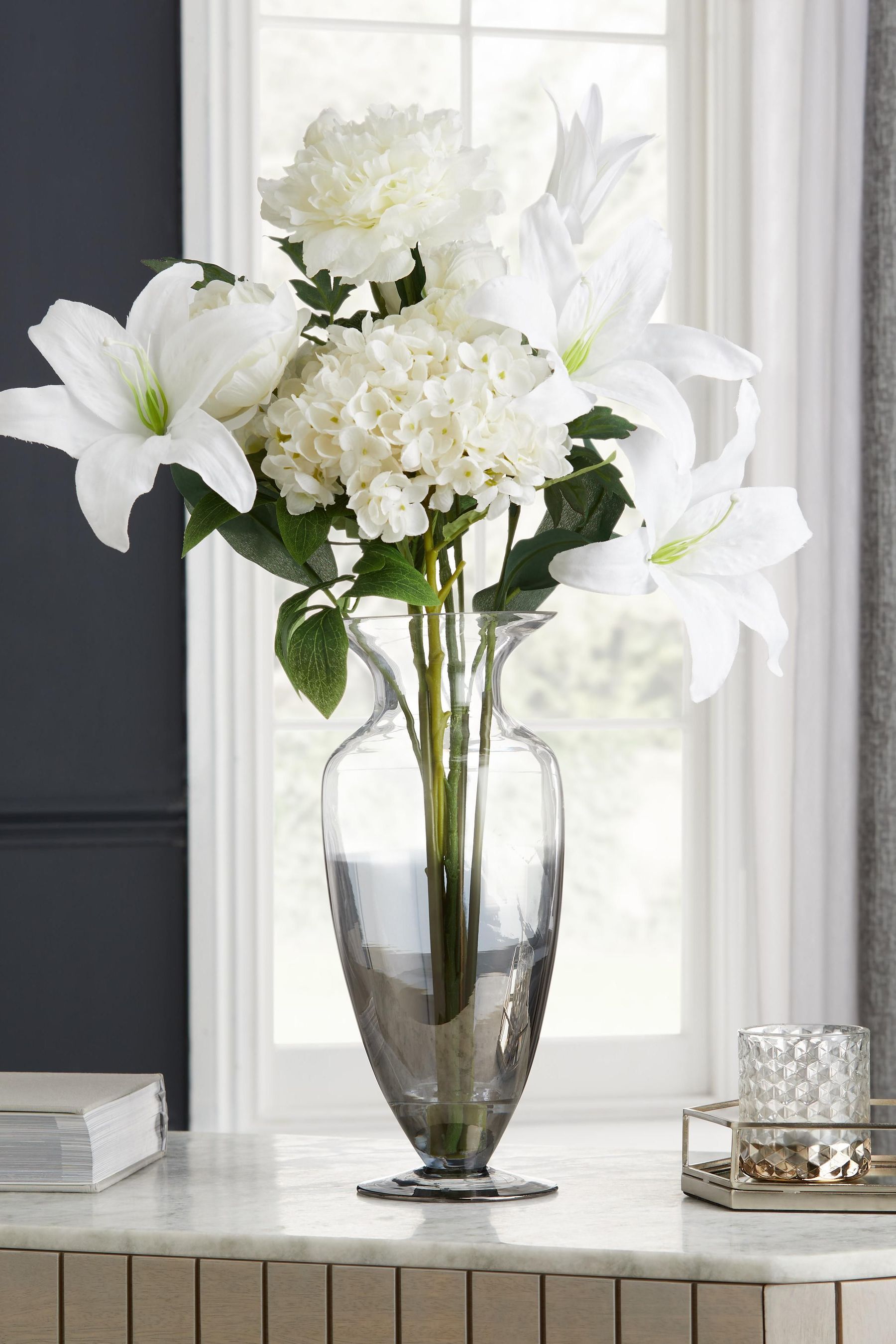 Buy Artificial White Flowers In Ombre Silver Glass Vase from Next Ireland