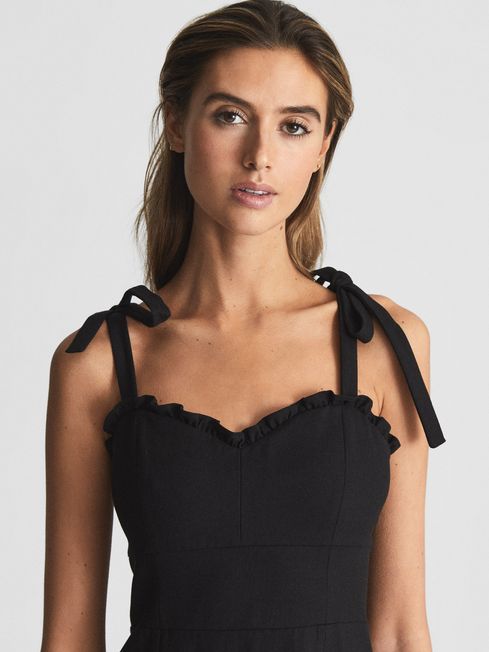 black dress with shoulder ties