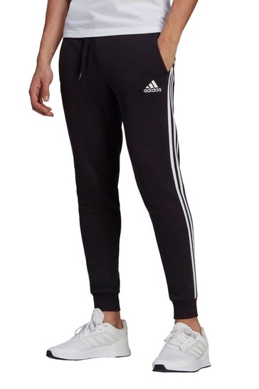 Buy adidas Sportswear Essentials Fleece Tapered Cuff 3-Stripes Joggers ...