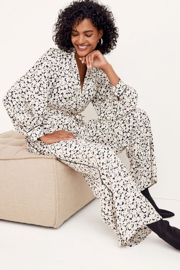 Buy Black White Floral Jacquard Collared Tie Waist Jumpsuit from