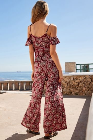 Red off hot sale the shoulder jumpsuit