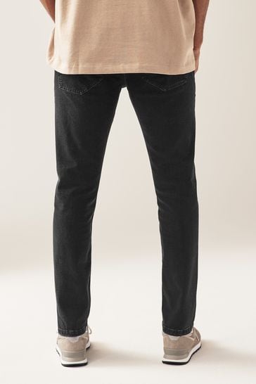 Black stretch skinny jeans men top