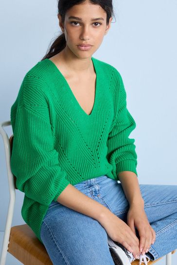 Bright shop green jumpers